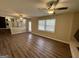 Spacious living room features hardwood floors, ample natural light, and a ceiling fan at 2270 Titan Ridge Dr, Decatur, GA 30035