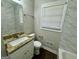 Updated bathroom with granite vanity, white sink, tiled shower, and window for natural light at 2804 Mitchell Dr, Decatur, GA 30032