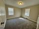 Comfortable bedroom with carpeted floor and two windows for ample natural light at 2804 Mitchell Dr, Decatur, GA 30032
