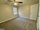 Cozy bedroom with carpet, ceiling fan, and a window at 2804 Mitchell Dr, Decatur, GA 30032