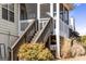Back stairs leading to a screened porch and backyard at 391 Hickory Lake Dr, Acworth, GA 30101