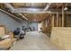 Unfinished basement with exposed beams and concrete walls provides opportunity for customization at 391 Hickory Lake Dr, Acworth, GA 30101