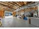 Spacious unfinished basement with exposed ceiling and concrete floor at 391 Hickory Lake Dr, Acworth, GA 30101