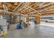 Spacious unfinished basement with exposed ceiling and concrete floor at 391 Hickory Lake Dr, Acworth, GA 30101