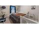 Cozy bedroom with a large window, blue curtains, and a gray and brown comforter at 391 Hickory Lake Dr, Acworth, GA 30101