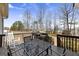 Deck showcasing outdoor seating, grill, and railing overlooking backyard at 391 Hickory Lake Dr, Acworth, GA 30101