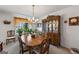 Dining room with dark wood china cabinet and matching dark wood table at 391 Hickory Lake Dr, Acworth, GA 30101