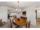 Dining room with a view into living spaces, and vintage-style pendant lighting at 391 Hickory Lake Dr, Acworth, GA 30101