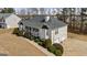Charming home featuring bay windows, a covered porch, manicured landscaping, and attached two-car garage at 391 Hickory Lake Dr, Acworth, GA 30101