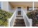 Welcoming front entrance with decorative plants and a classic wooden staircase at 391 Hickory Lake Dr, Acworth, GA 30101
