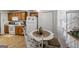 Traditional kitchen with wood cabinets, white appliances and an eat-in breakfast area at 391 Hickory Lake Dr, Acworth, GA 30101