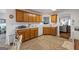 Open concept kitchen featuring modern appliances and wooden cabinetry at 391 Hickory Lake Dr, Acworth, GA 30101