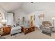 Bright living room featuring vaulted ceilings, neutral decor, and comfortable seating arrangement at 391 Hickory Lake Dr, Acworth, GA 30101