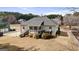Aerial view of a home with a wooden deck, stairs and a large backyard, perfect for outdoor enjoyment at 391 Hickory Lake Dr, Acworth, GA 30101