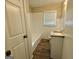 Updated bathroom featuring a tub and shower combination, new vanity, plank flooring, and fresh white paint at 2228 Headland Dr, East Point, GA 30344
