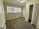 Cozy bedroom features a neutral color palette, plush carpeting and a large window at 2228 Headland Dr, East Point, GA 30344