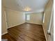 Large bedroom features wood floors, light walls, and natural light at 2430 Fern Valley Ct, East Point, GA 30344