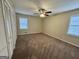 Large bedroom with carpet, ceiling fan, and windows at 2430 Fern Valley Ct, East Point, GA 30344