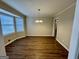 Bright dining room with wood floors, and modern chandelier at 2430 Fern Valley Ct, East Point, GA 30344