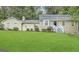 Charming home with a lush green lawn and well-maintained landscaping at 2430 Fern Valley Ct, East Point, GA 30344