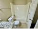 This bathroom includes a toilet, granite counter top, and shower at 890 Old Rocky Rd, Atlanta, GA 30349