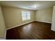This bedroom features a neutral color scheme and hardwood floors at 890 Old Rocky Rd, Atlanta, GA 30349