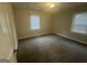 Serene bedroom with neutral paint, carpet flooring, and great natural light at 645 Steve Sw Dr, Atlanta, GA 30315