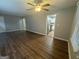 Open living room featuring wood-look flooring, neutral paint, and a seamless flow into the kitchen at 645 Steve Sw Dr, Atlanta, GA 30315