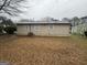 The backyard features a grey roof and a mostly brown lawn at 836 Amber Nw Pl, Atlanta, GA 30331