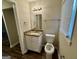 Well-lit bathroom with granite vanity top, white cabinet and fixtures at 836 Amber Nw Pl, Atlanta, GA 30331