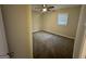 Bright bedroom with soft carpet, a ceiling fan, and a large window at 836 Amber Nw Pl, Atlanta, GA 30331