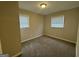Bedroom with carpeted floors, neutral walls, and dual windows at 836 Amber Nw Pl, Atlanta, GA 30331