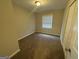 Cozy bedroom with neutral walls, carpet, and a window at 836 Amber Nw Pl, Atlanta, GA 30331