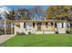 Charming single-story home with a well-maintained lawn and cozy front porch at 836 Amber Nw Pl, Atlanta, GA 30331
