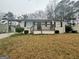 Traditional single-story home with a covered entry and mature landscaping at 836 Amber Nw Pl, Atlanta, GA 30331