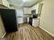 Modern kitchen featuring stainless steel appliances and ample cabinet space at 836 Amber Nw Pl, Atlanta, GA 30331