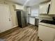 Updated kitchen showcasing stainless steel appliances and granite countertops at 836 Amber Nw Pl, Atlanta, GA 30331