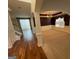Open-concept home with dining room with wainscoting, trey ceiling, and chandelier at 2618 Hooch Ct, Duluth, GA 30097