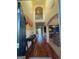 Grand two-story foyer with hardwood floors, elegant console table, and an arched doorway at 2618 Hooch Ct, Duluth, GA 30097