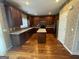 Well-equipped kitchen with an island, granite countertops, and dark wood cabinetry at 2618 Hooch Ct, Duluth, GA 30097