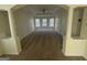 Bright living room with columns, carpet, and bay window nook with plenty of natural light at 2618 Hooch Ct, Duluth, GA 30097