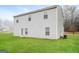 Exterior of the home showing large backyard with well maintained green grass and a level lot at 415 Arthurs Ln, Covington, GA 30016