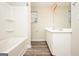 Bright bathroom featuring a tub and shower combination and a vanity with double sinks at 415 Arthurs Ln, Covington, GA 30016