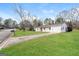 Well-kept single-story home featuring an attached garage and a long driveway at 430 Birch Se Ln, Conyers, GA 30094