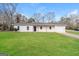 Charming single-story home with a well-maintained lawn and attached garage at 430 Birch Se Ln, Conyers, GA 30094