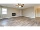 Spacious living room with a decorative fireplace and modern laminate flooring at 430 Birch Se Ln, Conyers, GA 30094