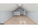 Spacious attic with neutral-toned walls, carpeted floors, and lighting at 395 Shadetree Ln, Lawrenceville, GA 30044