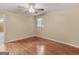 Bright bedroom featuring hardwood floors, a ceiling fan, and a window for natural light at 3 Ridge Dr, Hampton, GA 30228