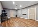 Finished basement featuring wood laminate floors and neutral walls at 1685 Tabor Dr, Marietta, GA 30062