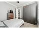 Neutral bedroom with carpet, open door, and a dark gray wardrobe at 1685 Tabor Dr, Marietta, GA 30062